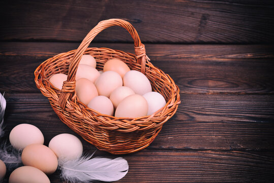 Wicker basket with raw chicken eggs