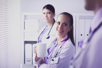 Young team or group of doctors standing in hospital