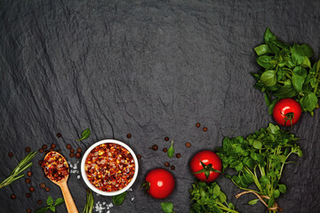 Sea salt, tomatoes and fresh organic basil. Ingredients for cooking. Food background on black slate table. Top view copy space. - 157102019