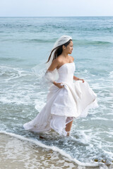 Fototapeta na wymiar Asian bride at beach
