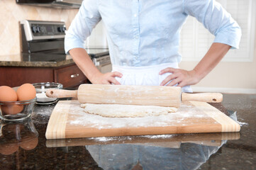 Fototapeta na wymiar Woman contemplating baking duties