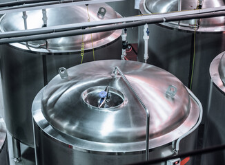 Metal tanks for storing and ripening beer.