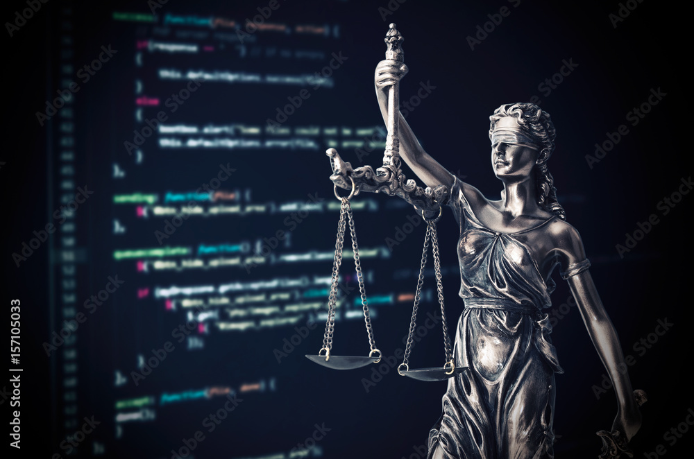 Wall mural justice statue with code on monitor device in background