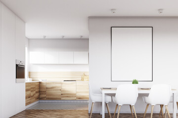 Front view of white kitchen with poster