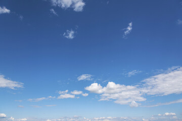 Obraz na płótnie Canvas White clouds on the blue clear sky.