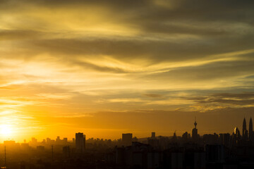 Fototapeta premium Silhouette of downtown Kuala Lumpur during majestic sunset 