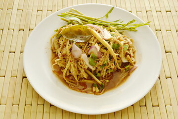 spicy shredded bamboo shoot salad in Thai northeastern style on plate