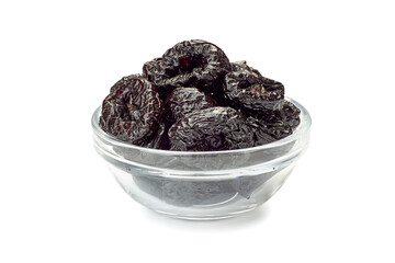 Bowl of dried plums on white