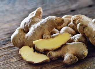 Fresh ginger root on wooden background