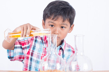 Cute little boy doing science experiment, science Education