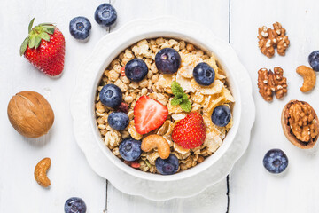 crunchy flakes with blueberries and various yogurts for healthy breakfast, close-up