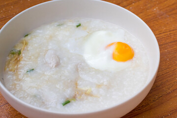 Pain rice porridge with boiled egg for breakfast