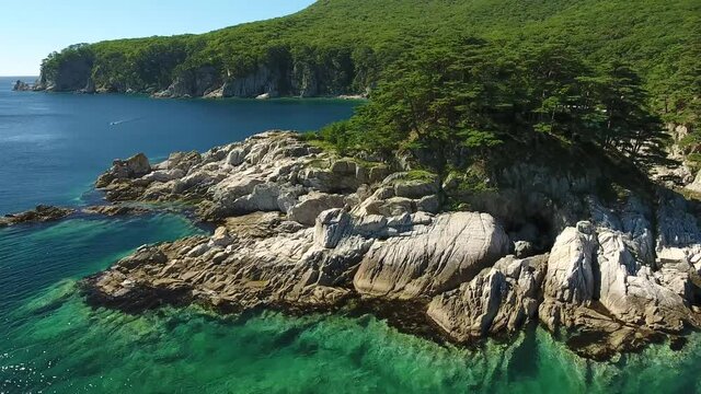 Rotation around Island of Languishing Heart. Far East Marine Biosphere Reserve Primorsky Krai Vladivostok Russia. Unique National park Japan Sea ocean. Aerial Helicopter Drone flight. 4k