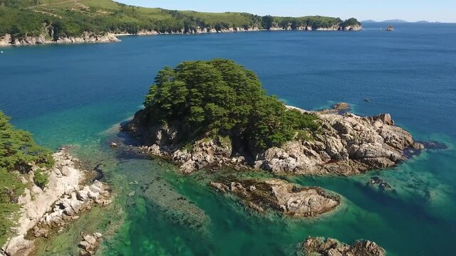 Island Languishing Heart blue water. Far East Marine Biosphere Reserve Primorsky Krai Vladivostok Russia. Unique National park Japan Sea ocean. Aerial Helicopter Drone flight around. 4k