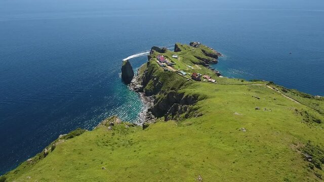 Gamov peninsula from above flight to Light house sea ocean. Far East Marine Reserve, Primorsky Krai Vladivostok Russia. Unique National park Japan Sea. Aerial Helicopter Drone. Colorful summer day