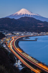 Winter Mt. Fuji with Long exposure of Tomei expressway at Suruga Bay , Shimizu Town , Shizuoka prefecture.