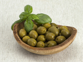 olive oil with olives in a wooden board. 