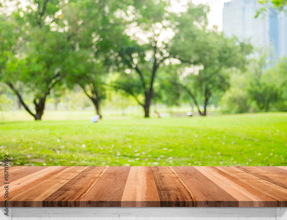Aufkleber empty brown wooden table top with blurred green fields at park, mock up template for display or mont
