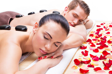 Attractive couple relaxing in spa salon.