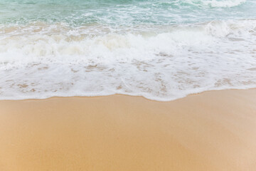 Soft Blue Ocean Wave On Sandy Beach. Background. Selective focus.