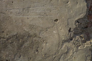 Fragment of a building with a concrete wall.