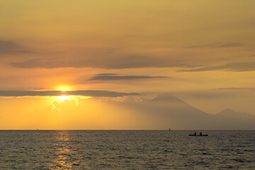 Fototapeta premium Traditional fisherman during majestic sunset in Lombok, Indonesia