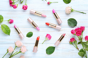Obraz na płótnie Canvas Colorful lipsticks on white wooden table