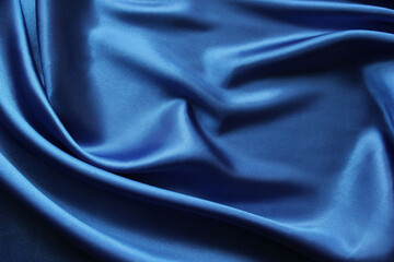 Abstract background blue satin fabric folds