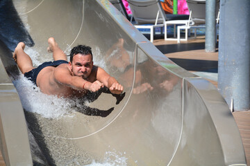 boy having fun on a water slide