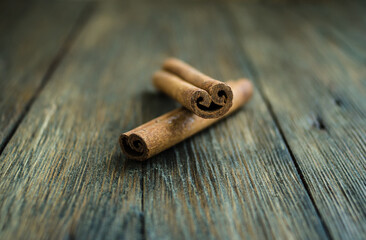 Cinnamon sticks and meal close up on wooden table. Cinnamon sticks spice close up background....