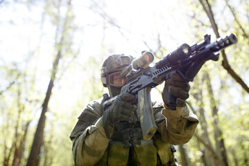 Soldier in helmet with weapon