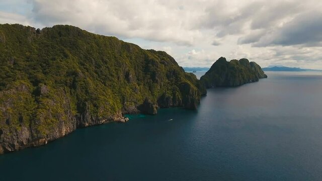 Tropical islands, aerial view. Aerial view: sea and the tropical island. Tropical bay in El Nido. Archipelago El Nido.Sandy beaches of the wild islands. Philippines National Marine Park. Aerial video
