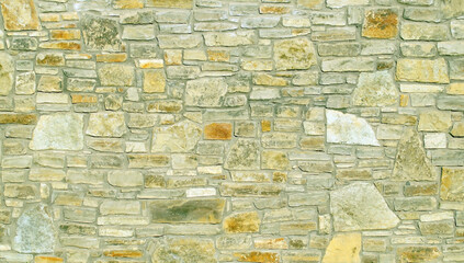 A pattern of flat stones. Grey stone wall background. Surface stone wall background.