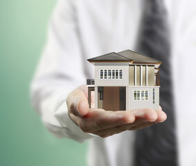 Home insurance concept in hand