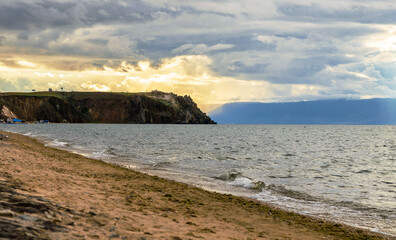 Sandy beach at sunset cloudy evening