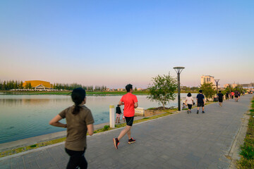 THAILAND,KHONKAEN-Feb 16, 2017: people are running at the lake before sunset