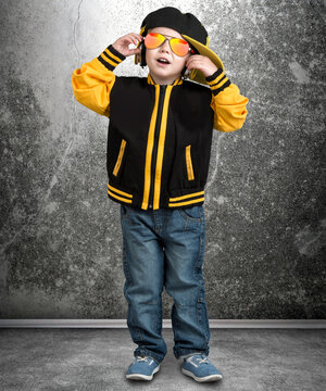 The little boy in the style of Hip-Hop . Children's fashion.Cap and jacket. The Young Rapper.Cool  dj.