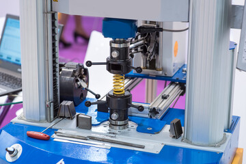High precision CNC machining center working, operator making automotive spring part process in factory