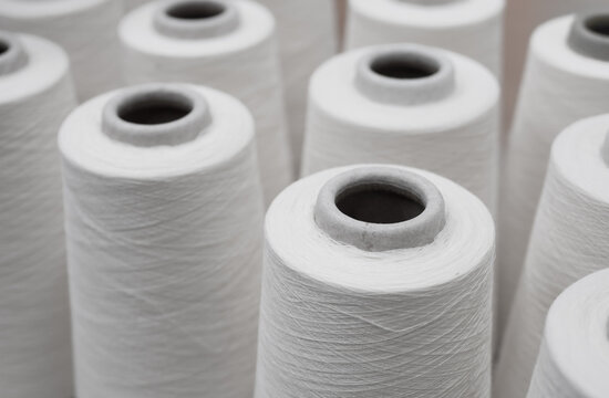 close up a lot of yarn spools in in a textile factory, Textile industry concept