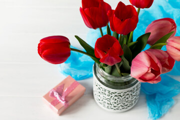 Background wedding. Beautiful fresh pink and red tulips of flowers in a vase. Copy space.