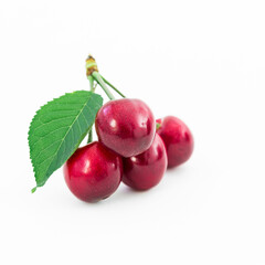 Cherries and leaf on white background. Summer berries