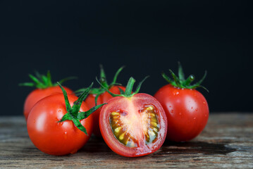 fresh tomato on black background