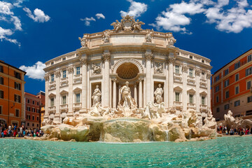 Rome Trevi Fountain or Fontana di Trevi in the sunny summer day, Rome, Italy. Trevi is the largest Baroque, most famous and visited by tourists fountain of Rome.