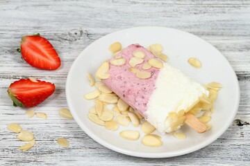 Homemade ice lolly from strawberries, cottage cheese & almond 