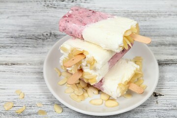 Homemade ice lolly from strawberries, cottage cheese & almond 