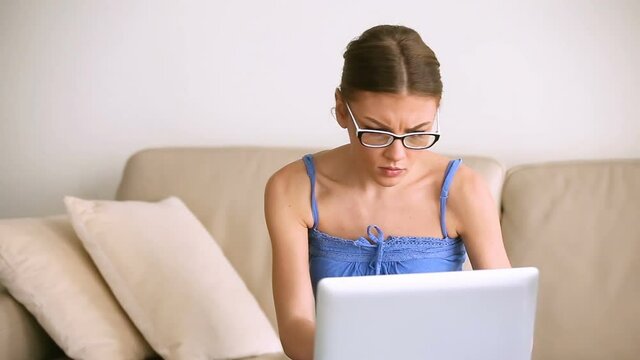 Worried troubled woman working on laptop, doing paperwork, having problem with documents, finding errors or miscalculation, missing deadline, unpaid debts and domestic bills, lot of work to do