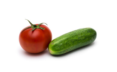Fresh vegetables on a white background, cucumbers and tomatoes