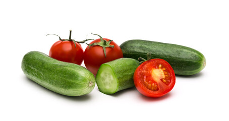 Fresh vegetables on a white background, cucumbers and tomatoes