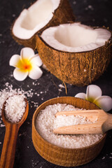 Coconut on wooden table .Organic and healthy food concept. Beauty and SPA treatment product.
