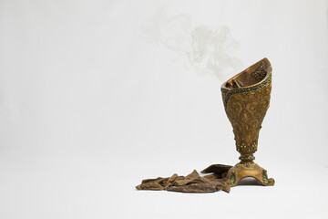 Agar wood, incense Chips, Arabic translation: Oud, used in Ramadan and occasions to incense Cloths, furniture and places